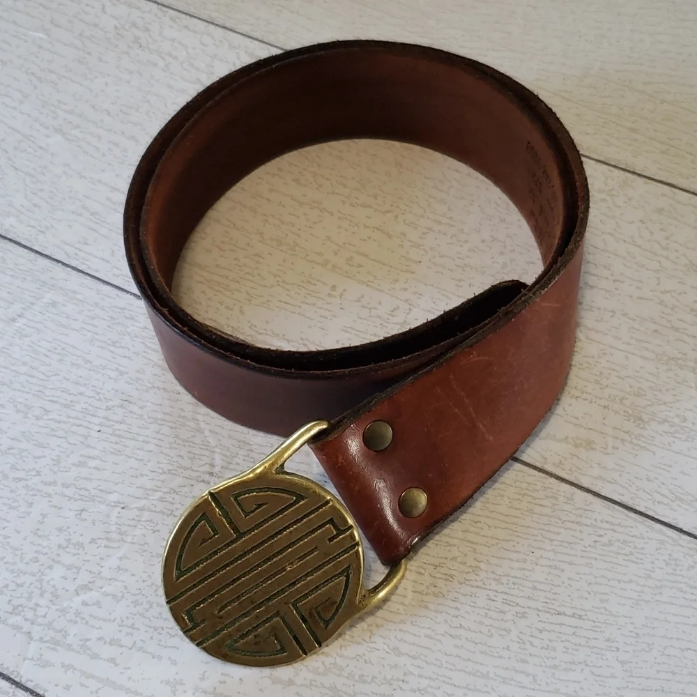 Compared to what brown leather strap with gold buckle